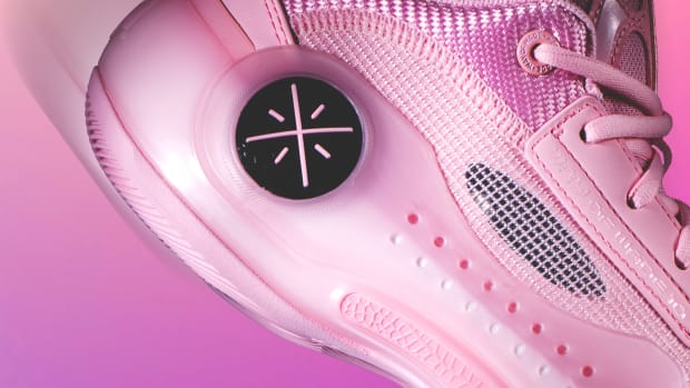 Side view of Dwyane Wade's pink basketball shoes.